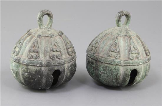 A pair of Chinese bronze bells, possibly Tang dynasty, 11.5cm